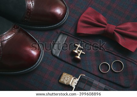 Men burgundy suit, bow tie and vintage leather shoes