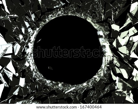 Bullet hole and pieces of shattered glass on black