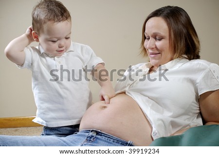 A pregnant mother talks to her toddler about the sibling soon to arrive.