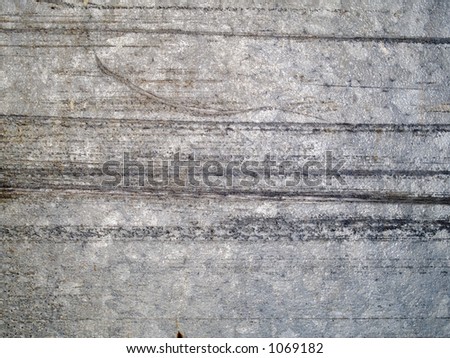 Stock macro photo of the texture of scratched metal.  Useful for grunge layer masks and abstract backgrounds.