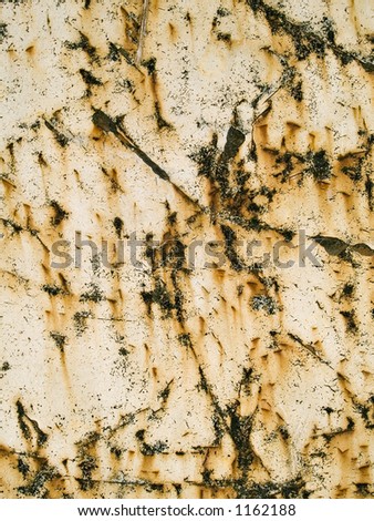 Stock macro photo of the texture of peeling, scratched, rusting,  painted metal.  Useful for abstract backgrounds and grunge layers.