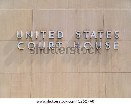 A sign identifying a building as a U.S. federal court house.