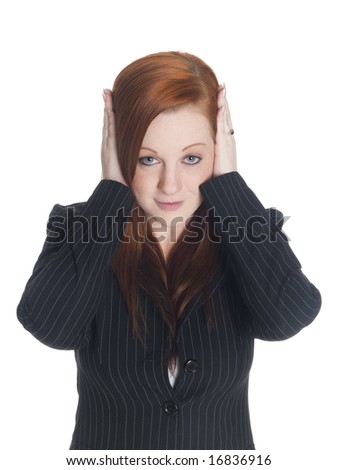 Isolated studio shot of a businesswoman in the Hear No Evil pose.