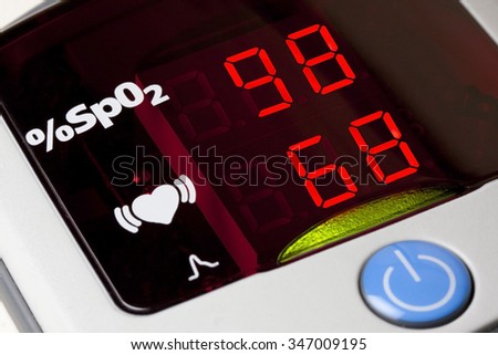 Closeup of display of pulse oximeter to measure pulse rate and blood oxygen saturation