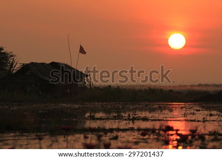 The sun rise in the morning sun reflecting on the water on the Han ,Northern,Thailand.