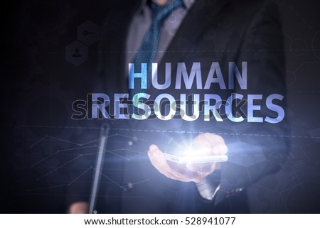 Businessman Use Smartphone And Selecting  Human Resources, Touch Screen. Virtual Icon. Graphs Interface. Business concept. Internet concept. Digital Interfaces