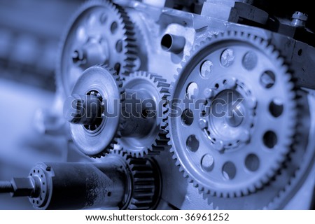 Gears, aircraft power engine details. Industrial machinery background.