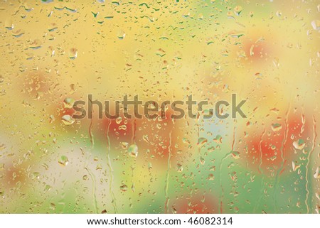 Water drops on window glass on rainy day