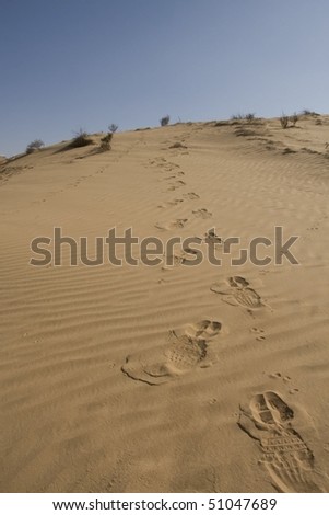 footprints in sand dunes