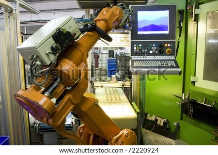 part of the cnc milling machine with control panel and robot