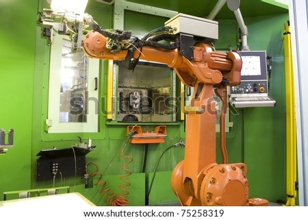part of the cnc milling machine with control panel and robot