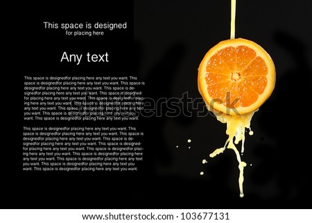 Orange juice splashing isolated on black