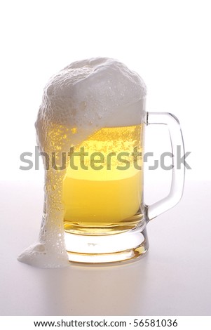 stock photo Beer mug with froth over white background