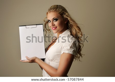 young sexy business woman holding empty white board