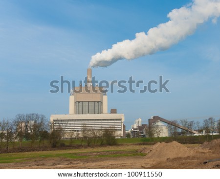 power plant with smoking chimney in Nijmegen, Netherlands