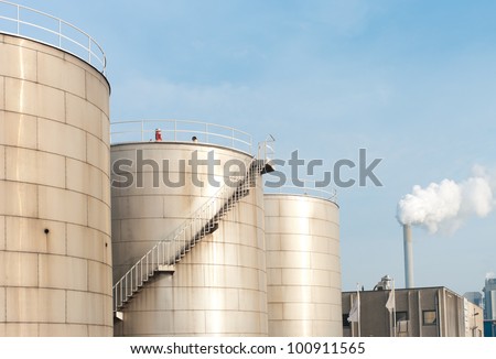 several petrol tanks for oil and gasoline in an industrial area