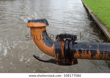 ground water being pumped away into a pond