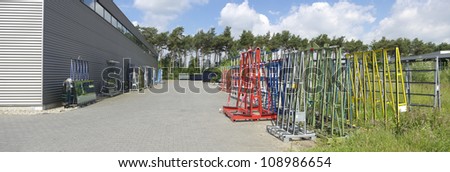 colorful empty racks for transporting window frames and glass panes