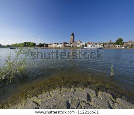 wide angle view on Deventer, Netherlands from the other side of the IJssel river. The church is the gothic Lebuinus Church, build between 1450 and 1525.