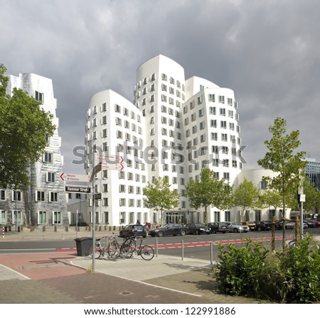 DUSSELDORF, AUGUST 11: Media Harbor area on august 11, 2012 in Dusseldorf. This building complex was designed by Frank O. Gehry and completed in 1998. There are three versions: white, red and silver.