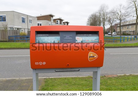 AMERSFOORT, NETHERLANDS - DEC 15: Mailbox on dec 15, 2012 in Amersfoort, Netherlands. Dutch postal services owns about 20,000 of these boxes. They are emptied at least once a day, except on saturdays.