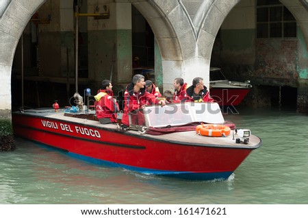 VENICE - MAY 30: Firefighters on may 30, 2013 in Venice, Italy. The Vigili del Fuoco, established in 1941, merged all the fire protection bodies previously existing in various towns and countries.