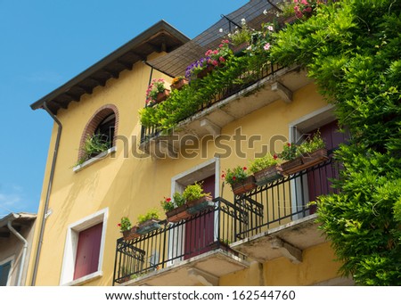 characteristic Mediterranean house decorated with blooming flowers
