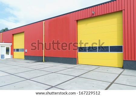 yellow roller doors in an industrial warehouse