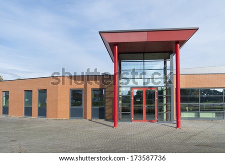 red entrance of a modern office building