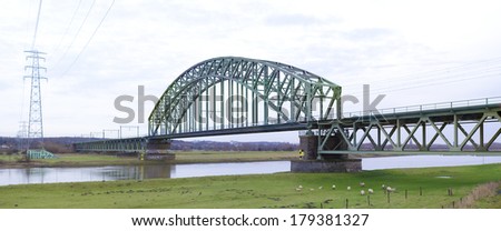 Historical railway bridge crossing the river Rhine at Oosterbeek, the Netherlands. Famous for its part at the battle of Arnhem during the second World War