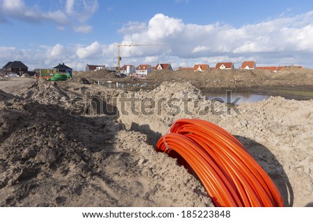 bundle orange fiber cable on a construction site