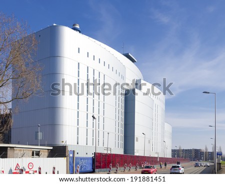 ROTTERDAM - MARCH 8, 2014: Former AVR Rijnmond waste incineration plant. The flue gas purifiers are covered with special aluminum facades. The special red rose wall is designed by Lydia Schouten.