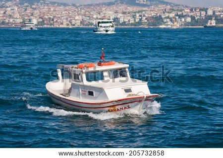 ISTANBUL - APRIL 29, 2014: Small boat at the golden horn, a horn-shaped estuary, and a major urban waterway. It is also the primary inlet of the Bosphorus.