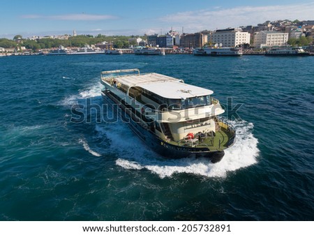 ISTANBUL - APRIL 29, 2014: Ferry boat at the golden horn, a horn-shaped estuary, and a major urban waterway. It is also the primary inlet of the Bosphorus.