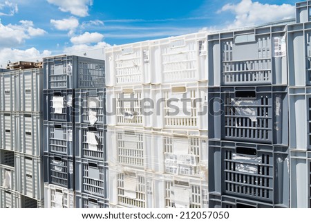 piled up empty plastic crates on an industrial area