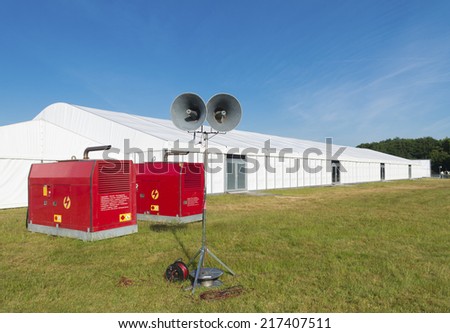 large white event tent with power supply and broadcasting system
