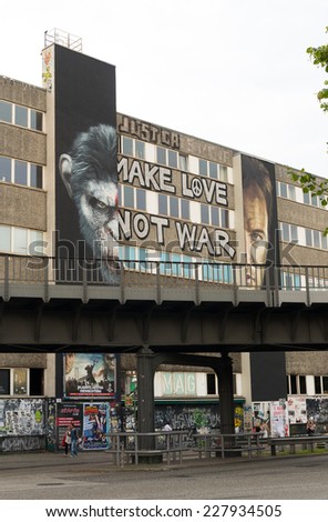 BERLIN - JULY 27, 2014: murial on a house facade with the slogan \
