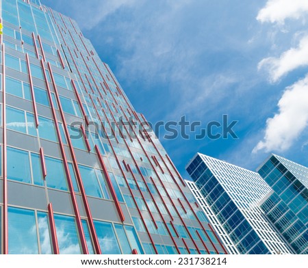 ALMERE, NETHERLANDS - AUGUST 3, 2014: Facades of modern office buildings. It is the youngest and fastest growing city in the country, founded around 1975.