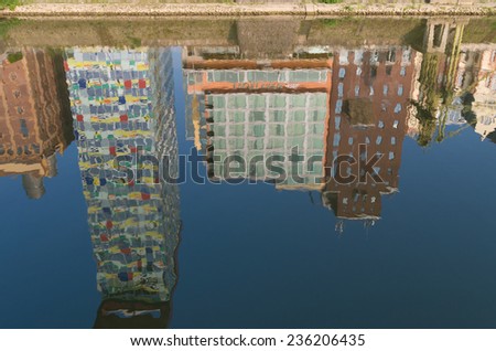 DUSSELDORF - SEPTEMBER 6, 2014: Reflection of office buildings in the media harbor. The Hafen district contains some spectacular post-modern architecture, but also some bars, restaurants and pubs