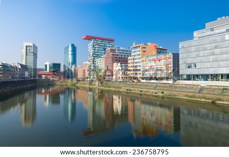 DUSSELDORF - SEPTEMBER 6, 2014: Modern office buildings in the media harbour. The Hafen district contains some spectacular post-modern architecture, but also some bars, restaurants and pubs.
