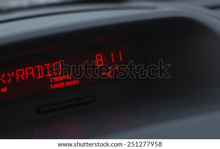 DEVENTER, NETHERLANDS - FEBRUARY 7, 2015: Display of a digital car radio with time and outside temperature