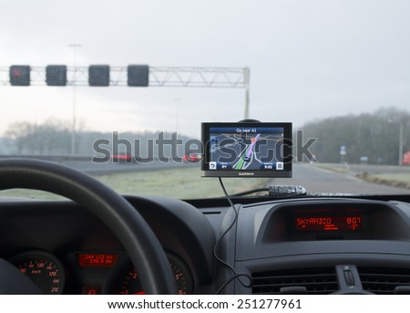 DEVENTER, NETHERLANDS - FEBRUARY 7, 2015: Garmin gps navigation device in a car. Garmin is one of the largest manufacturers of GPS devices.