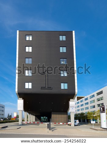 ROTTERDAM - OCTOBER 4, 2014: Dockworks office building in the Rotterdam port. It is the maritime business center of Rotterdam and exists of four independent buildings, connected by a teak deck