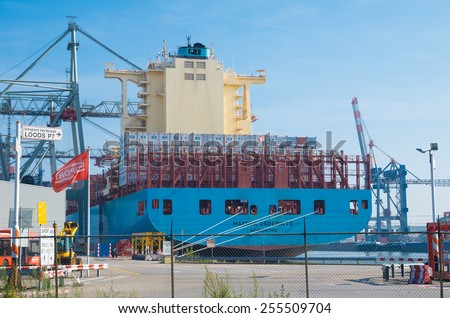 ROTTERDAM - OCTOBER 4, 2014: Container ship in Rotterdam port. It is the largest port in Europe, covering 105 square kilometers (41 sq miles)