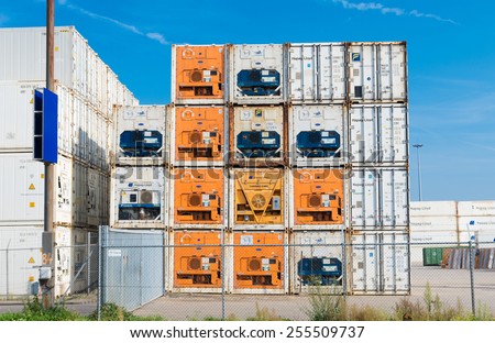 ROTTERDAM - OCTOBER 4, 2014: Piled up reefer containers in the rotterdam port. It is the largest port in Europe, covering 105 square kilometers (41 sq miles)