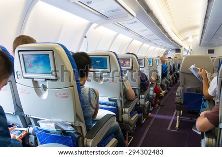 GUANGZHOU, CHINA - MAY 10, 2015: Interior of a China Southern Airlines Company Limited (CSN) commercial airplane. It is the largest airline company in China and is founded in 1995