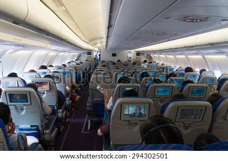 GUANGZHOU, CHINA - MAY 10, 2015: Interior of a China Southern Airlines Company Limited (CSN) commercial airplane. It is the largest airline company in China and is founded in 1995