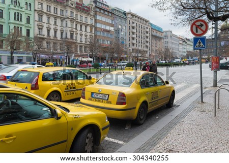 PRAGUE, CZECH REPUBLIC - DECEMBER 23, 2014: Yellow Skoda taxis waiting for customers in the city center.