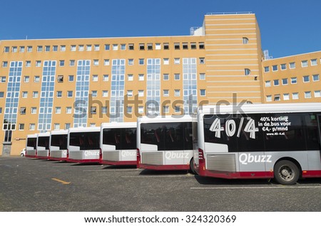 GRONINGEN, NETHERLANDS - AUGUST 22, 2015: Line of city buses at the groningen central station. This station is the main railway hub of the northeastern part of the country