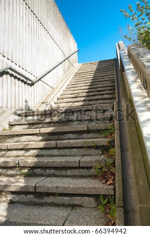 concrete steps leading up to a blue sky
